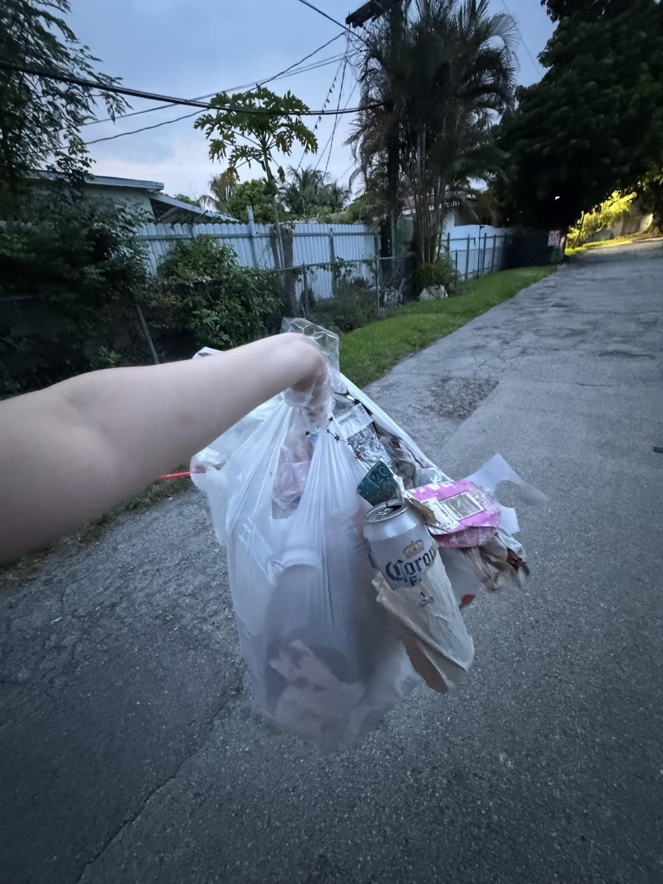 A bag of litter collected on an evening walk through the neighborhood
